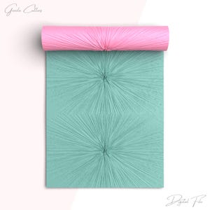 May include: A teal blue digital paper with a repeating pattern of two starburst designs. The paper is rolled up and the end is pink.