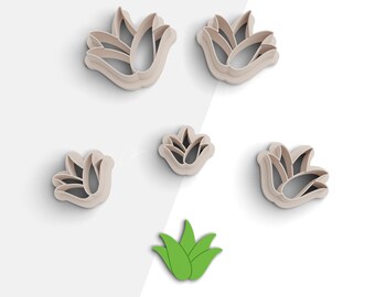 May include: Set of six cookie cutters featuring a tulip flower design in various sizes. The cutters are made of a light beige plastic and are arranged on a white background. There is also a green leaf cutter included in the set.