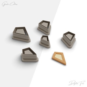 May include: Set of six gray diamond-shaped cookie cutters with one orange diamond-shaped cookie cutter. The cutters are arranged on a white background. The text "Gazda Cutters" appears in the top left corner of the image. The text "Digital File" appears in the bottom right corner of the image.