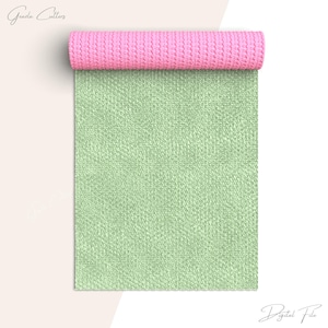 Könnte beinhalten: Eine digitale Datei eines strukturierten Stoffes in Grün und Rosa. Der Stoff ist aufgerollt und die rosa Seite ist zur Kamera gerichtet.