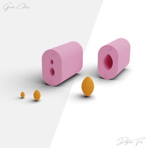 Puede incluir: Un molde de silicona rosa con dos formas ovaladas de diferentes tamaños. El molde se muestra junto a tres pequeños moldes de silicona naranja. El texto "Gazda Cutters" está en la parte superior de la imagen. El texto "Digital File" está en la parte inferior de la imagen.