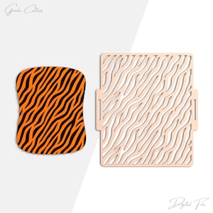 May include: Two decorative laser-cut designs. One is a rectangular shape with a tiger stripe pattern in black and orange. The other is a light peach-colored square with a wave-like pattern.