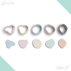 May include: A set of 10 cookie cutters in various shapes and colours. The cutters include a heart, a circle, a teardrop, a rounded rectangle, and a freeform shape. The cutters are arranged in two rows on a white background.