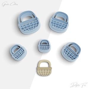 May include: Set of six blue plastic cookie cutters shaped like baskets with a woven pattern. The cutters are arranged on a white background. The text "Digital File" is visible in the bottom right corner of the image.
