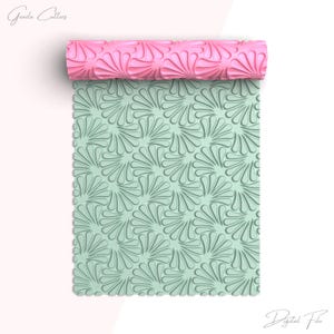 May include: A pink textured rolling pin rests above a mint green patterned sheet. The sheet features a repeating fan-like design. The words "Greeda Cutters" and "Digital File" are written in cursive.
