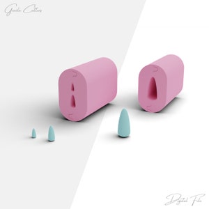 May include: Two pink silicone moulds for making fondant or gum paste decorations. The moulds are shaped like a teardrop and a pointed oval. There are three small blue fondant cutters in the foreground.