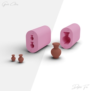 May include: A pink silicone mold with three vase shapes. The mold is open and there are three small brown ceramic vases next to it.
