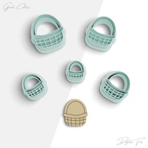 May include: Set of six cookie cutters in the shape of baskets. The cutters are made of light blue plastic and come in various sizes. The smallest cutter is a brown basket.