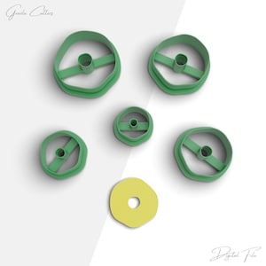 May include: A set of six green plastic cookie cutters in various sizes and shapes, including a donut shape. The cutters are arranged on a white surface. The text "Gazda Cutters" appears in the top left corner of the image. The text "Digital File" appears in the bottom right corner of the image.