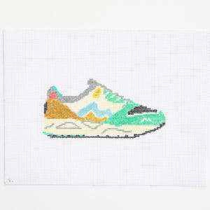 Hand-painted needlepoint canvas, featuring a Karhu shoe
