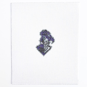 May include: A needlepoint canvas featuring a detailed, pixelated image of the state of New Jersey in shades of purple, blue, and white. The canvas is square, with a white background and a grid pattern.