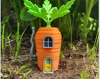 May include: A carrot-shaped house with a green leafy roof, a gray chimney, and two windows. The house has a small door with a heart-shaped window.