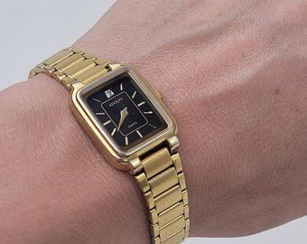 Montre femme vintage Adolfo dorée à quartz