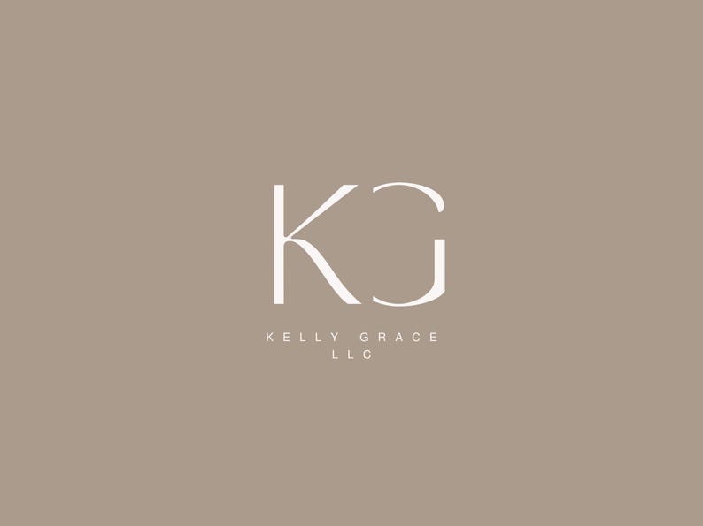 May include: A white logo with the letters "KG" in a stylized font. The text "KELLY GRACE LLC" is below the logo.
