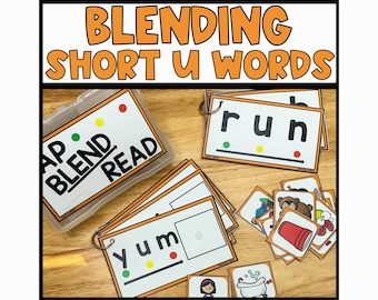 May include: A set of colorful flash cards for teaching children to blend short u words. The cards feature the words "run", "yum", and "cup" with corresponding pictures. The cards are labeled "Blend and Read".