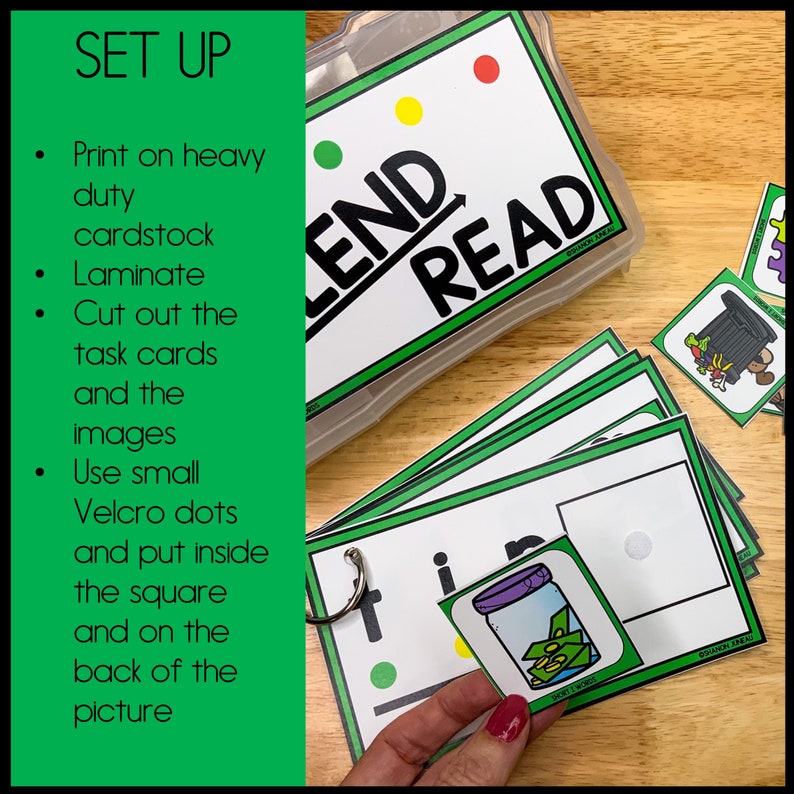 May include: Green and white task cards with a green dot and a black line. The cards have the words "LEND" and "READ" on them. A hand is holding a green card with a picture of a jar with money inside. The card has the word "in" on it.