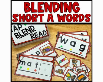 May include: A set of colorful flash cards for teaching children to blend short a words. The cards feature the words "mat", "wag", and "tap" with color-coded dots to represent the sounds of each letter. The cards are labeled "Tap, Blend, Read".
