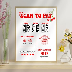 May include: A framed white sign with red text that says "SCAN TO PAY" and includes QR codes for Venmo, PayPal, and Cash App. It also says "WE ALSO ACCEPT" with icons for cash and card, and "PLEASE LEAVE A REVIEW".