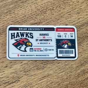 May include: A rectangular sticker designed as a Briar University Hawks vs. St. Anthony's hockey ticket. It features a hawk mascot logo, the date Saturday Feb. 22, 2025, at 7:00 PM, location in Massachusetts, and seat details: Sec. 108, Row C, Seat 14.