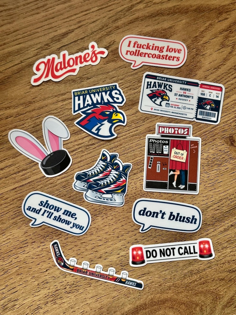 May include: A collection of vinyl stickers featuring various designs including a Briar University Hawks hockey ticket, a photo booth, ice skates, a hockey puck with bunny ears, and speech bubbles with text like I fucking love rollercoasters.