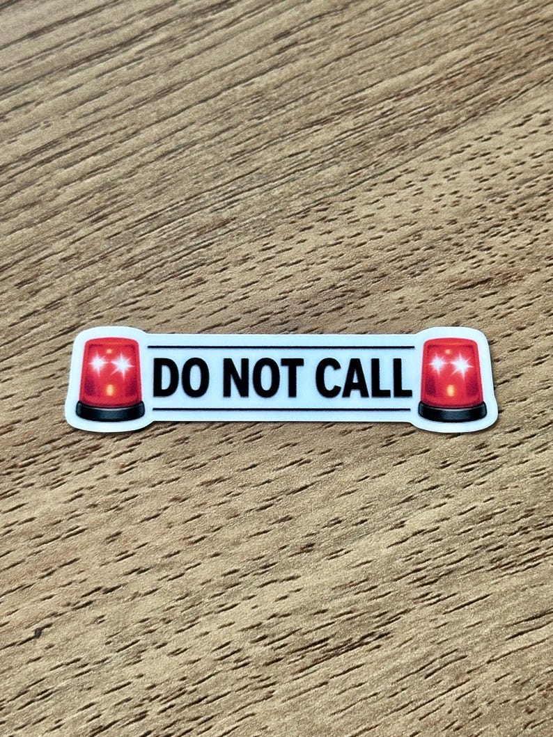 May include: A rectangular sticker with a white background and a black border. The text DO NOT CALL is printed in black capital letters in the center. On both the left and right sides of the text, there is a red emergency siren light icon.