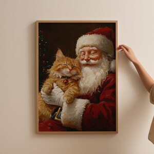 May include: A painting of Santa Claus holding a ginger cat in his arms. Santa is wearing a red suit with white trim and a white beard. The cat is looking up at Santa with its eyes closed. The background is a dark brown color.