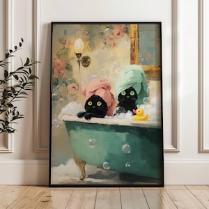 May include: Framed art print featuring two black cats in a teal bathtub, each wearing a towel. The cats are surrounded by bubbles and a yellow rubber duck. The background includes floral wallpaper and a wall-mounted light fixture.