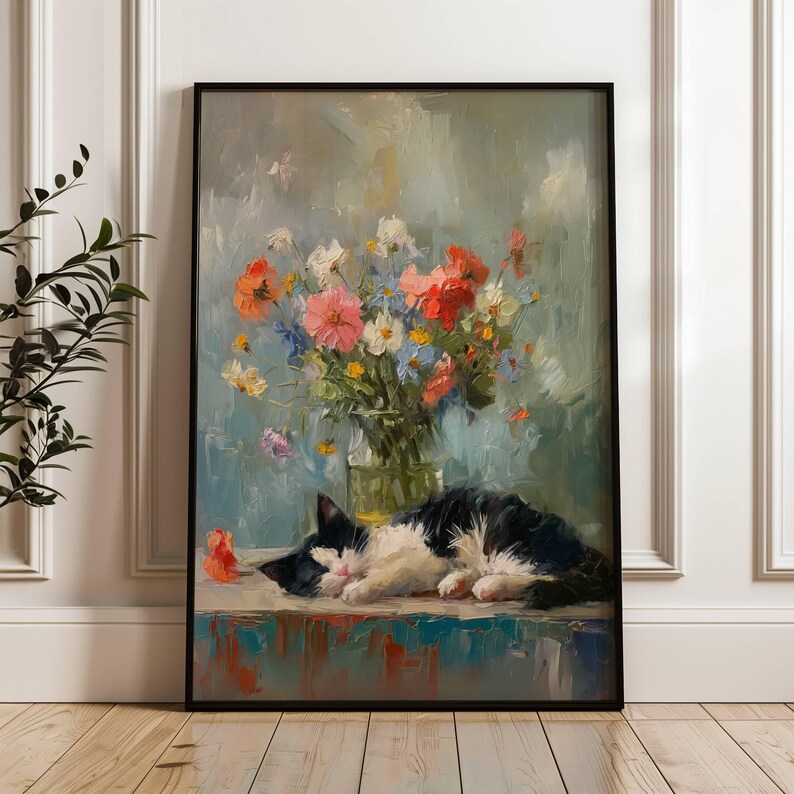 May include: A framed oil painting depicts a black and white cat sleeping peacefully next to a vase of colorful flowers. The flowers include pink, red, white, and blue blooms. The background is a soft blue with brushstrokes.