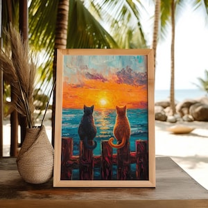 May include: A framed painting of two cats sitting on a wooden fence overlooking a sunset over the ocean. The cat on the left is black and the cat on the right is orange.