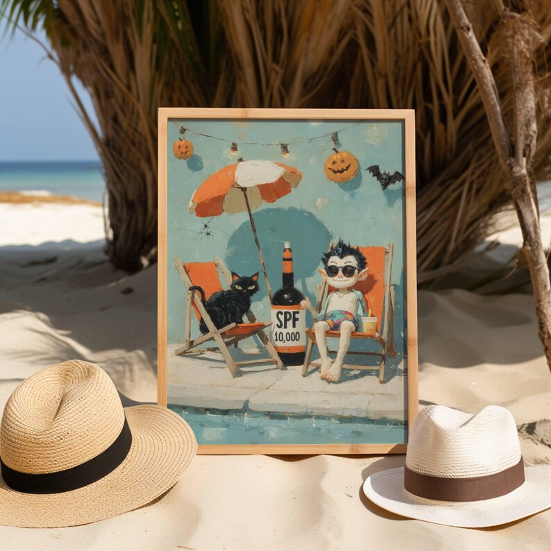 May include: A framed print depicts a cartoon vampire relaxing on a beach chair with a black cat, under an orange and white umbrella. A bottle of SPF 10,000 sunscreen is nearby. The scene is set on a sandy beach with a blue ocean backdrop.