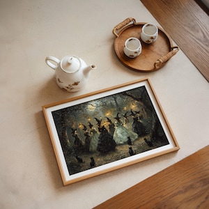 May include: A framed print depicts a gathering of witches in a moonlit forest, with black cats scattered around. The artwork is in a wooden frame, and a white teapot and two teacups on a wooden tray are also visible.