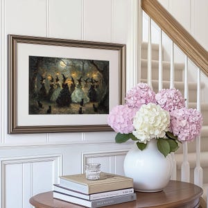 May include: Framed artwork depicting a gathering of witches in a moonlit forest, with black cats. The artwork is in a gold frame, mounted on a white paneled wall. A white vase holds pink and white hydrangeas, and books are on a wooden table.