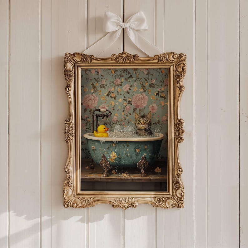 May include: A framed illustration of a cat taking a bath in a blue and white bathtub with a yellow rubber ducky. The bathtub is on a wooden surface with a floral wallpaper background.