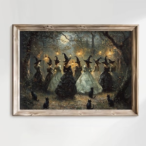 May include: A framed print depicts a gathering of witches in a moonlit forest. The witches, in elegant gowns and pointed hats, are surrounded by black cats and lanterns. The artwork has a vintage, gothic aesthetic.