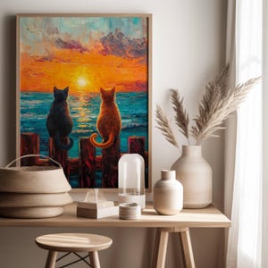 May include: A painting of two cats sitting on a wooden fence overlooking a sunset over the ocean. The cat on the left is black and the cat on the right is orange.