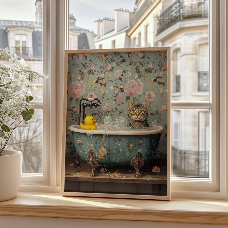 May include: A tabby cat sits in a blue and white floral bathtub with a yellow rubber ducky. The bathtub is on a wooden floor with a floral wallpaper background.