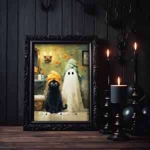 May include: A framed art print depicts a black cat and a ghost in a bathroom setting. The cat wears a yellow towel on its head, and the ghost is draped in a white sheet and green towel. The frame is black, and the background is dark.