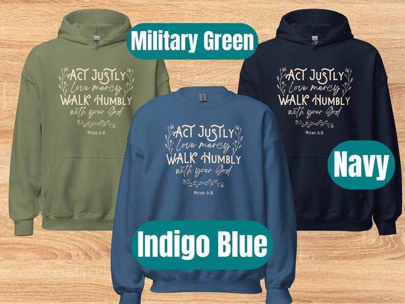May include: Three hooded sweatshirts in different colors: military green, indigo blue, and navy. Each sweatshirt features a white graphic with the text "ACT JUSTLY Love mercy WALK HUMBLY with your God Micah 6:8".