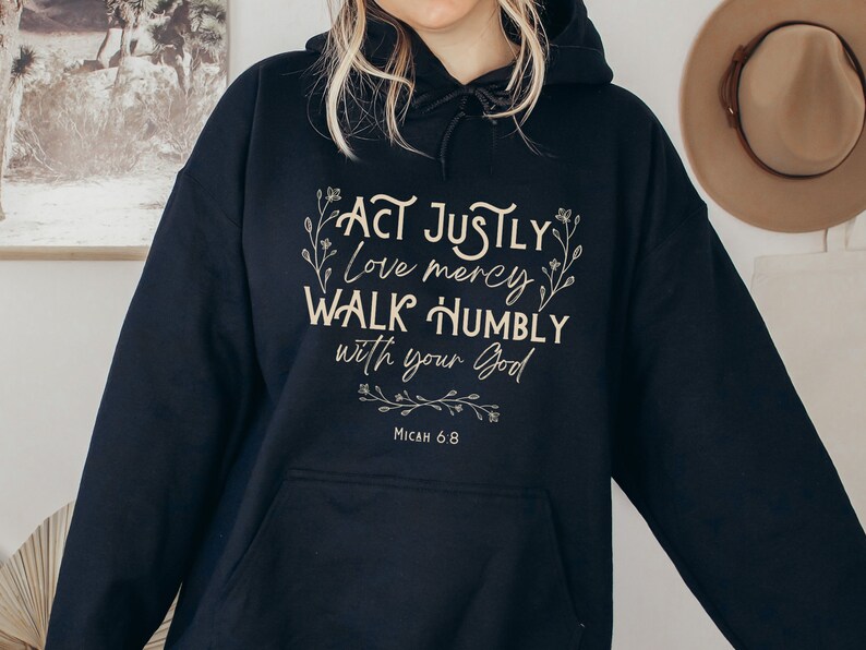 May include: Black hooded sweatshirt with the text "Act justly, love mercy, walk humbly with your God" and "Micah 6:8" in a cream color font.