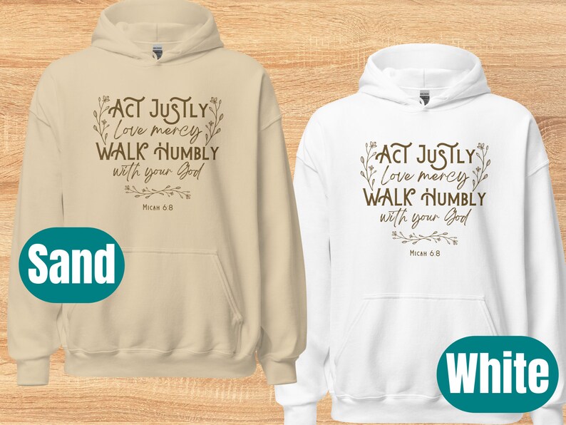 May include: Two hooded sweatshirts, one in sand and one in white, with the text "ACT JUSTLY Love mercy WALK HUMBLY with your God Micah 6.8" printed in brown on the front.
