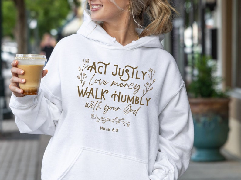 May include: White hoodie with a brown graphic print that says "Act justly, love mercy, walk humbly with your God, Micah 6:8".