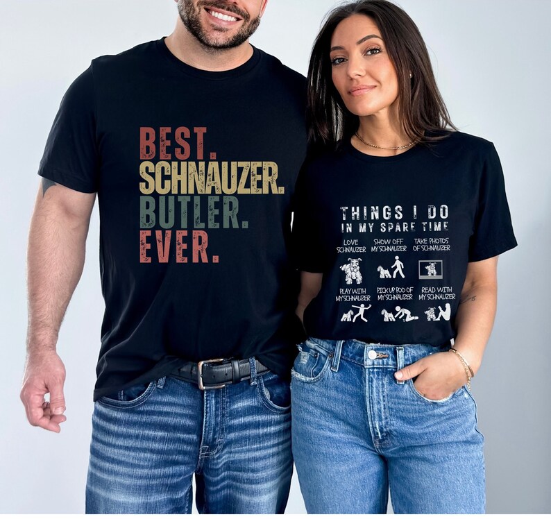 May include: A couple wearing black t-shirts with a Schnauzer theme. The man's shirt says "Best. Schnauzer. Butler. Ever." The woman's shirt says "Things I do in my spare time" and lists activities like "Love Schnauzer", "Show off my Schnauzer", and "Take photos of Schnauzer".