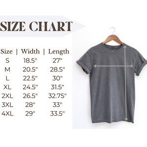May include: A gray t-shirt hanging on a wooden hanger. The image includes a size chart with measurements in inches for width and length, ranging from size small to 4XL.