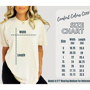 May include: Size chart for a t-shirt with measurements in inches. The chart shows the width and length of the shirt in sizes S, M, L, XL, 2XL, 3XL, and 4XL. The text "Comfort Colors C1717" is at the top of the chart. The text "Model is 5'2' Wearing Medium For Reference" is at the bottom of the chart.