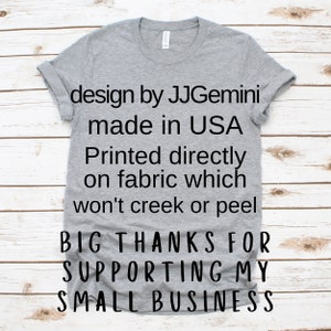 May include: Grey t-shirt with black text that reads "design by JJGemini made in USA Printed directly on fabric which won't creek or peel BIG THANKS FOR SUPPORTING MY SMALL BUSINESS"