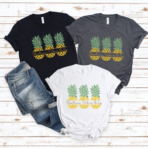 May include: Three white t-shirts with a graphic of three pineapples and the text "Positive Vibes Only".