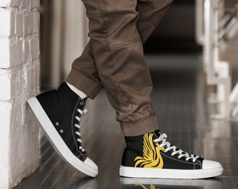 May include: Black high-top canvas shoes with a white sole and a yellow phoenix design on one shoe.