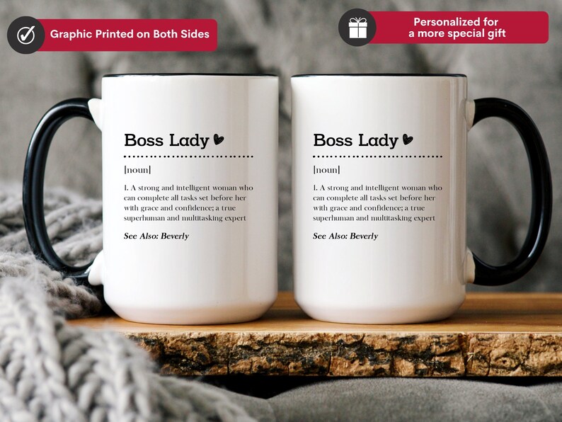 May include: Two white ceramic mugs with black handles and rims. Each mug features black text reading Boss Lady followed by a dictionary-style definition describing a strong, intelligent person who completes tasks with grace, confidence, and multitasking expertise.