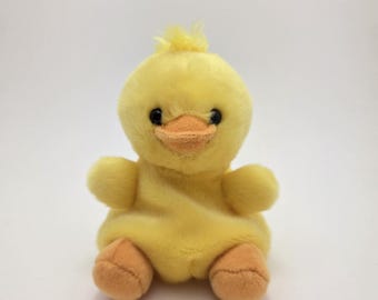 Pollito amarillo de peluche de Aurora Palm Pals (10 cm)