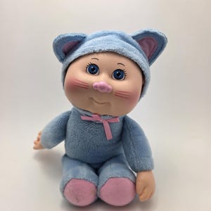 May include: A rustic wooden sign with the text "Welcome to our home" in a handwritten style. The sign features a distressed finish and a simple, inviting design, perfect for a front porch or entryway.